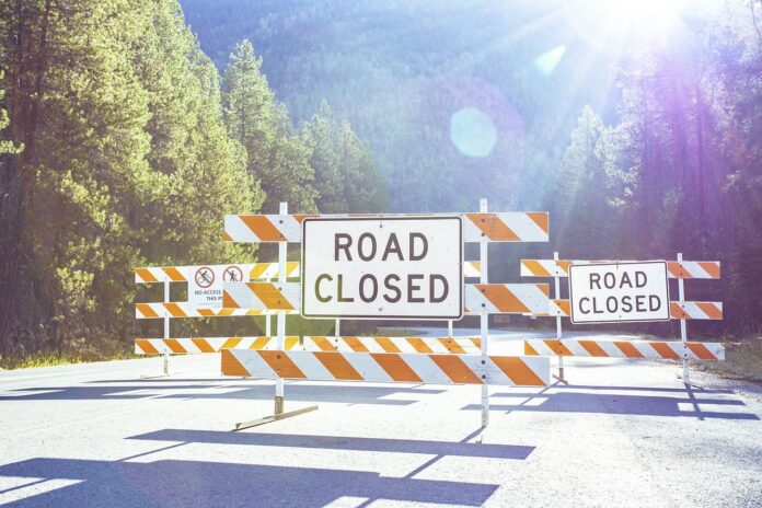 Road closed barricade sign