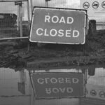 grayscale photo of road closed